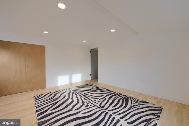 bedroom featuring light hardwood / wood-style flooring and a closet