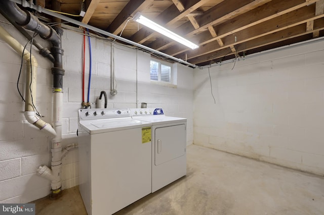 washroom with washing machine and clothes dryer