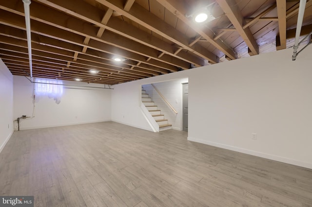 basement with wood-type flooring