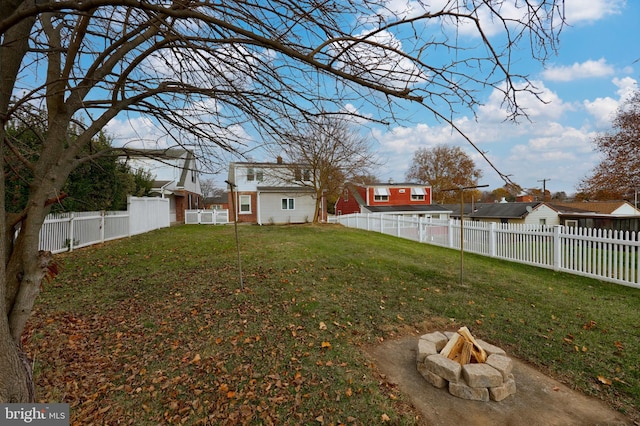 view of yard with an outdoor fire pit