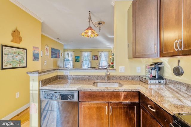 kitchen featuring crown molding, sink, light wood-type flooring, appliances with stainless steel finishes, and light stone counters