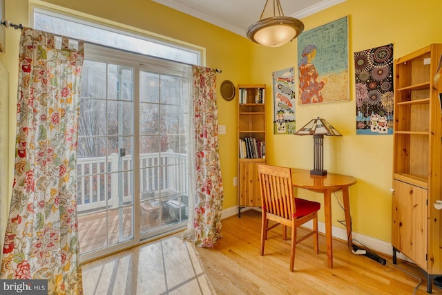 office area featuring wood-type flooring and crown molding