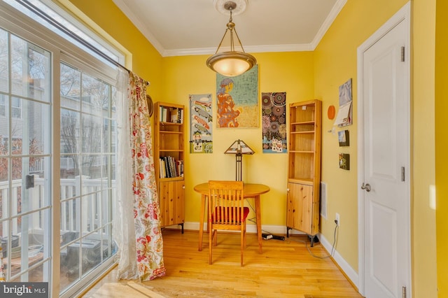 sitting room featuring wood-type flooring and crown molding