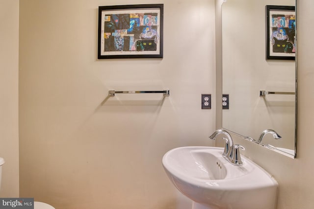 bathroom with toilet and sink