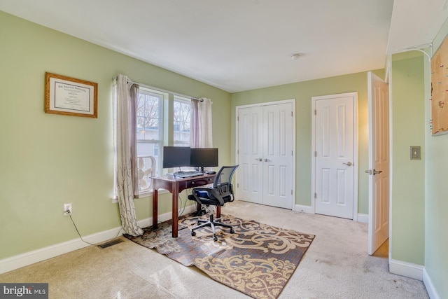 office area with light colored carpet