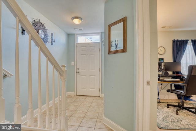 entrance foyer with light tile patterned floors