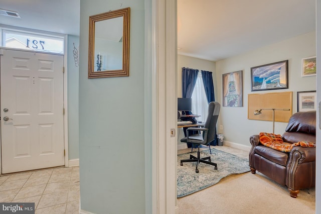 office with light tile patterned floors