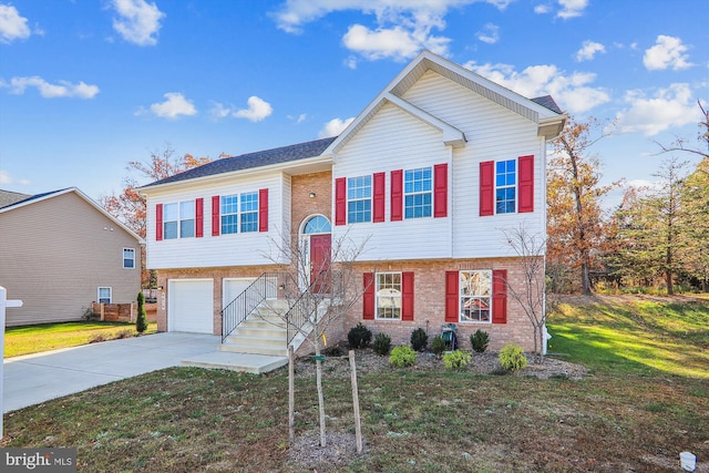 4639 Pendall Dr, Fort Washington, MD 20744 - split foyer home featuring concrete driveway, brick siding, a front lawn, and an attached garage