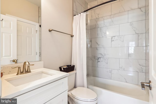 full bathroom with vanity, shower / bath combo, and toilet