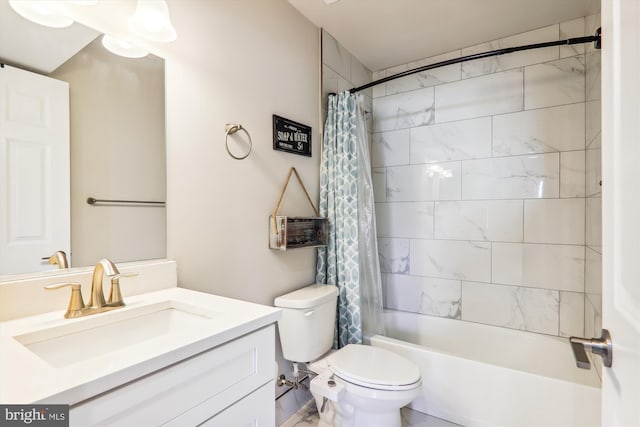 full bathroom with vanity, shower / tub combo, and toilet