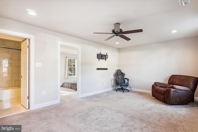 unfurnished room featuring light carpet and ceiling fan