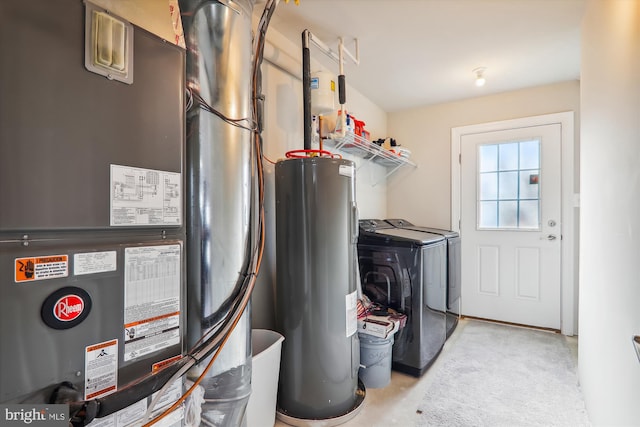 utility room featuring heating unit, water heater, and separate washer and dryer