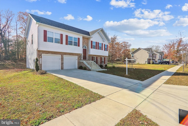 split foyer home with a front yard and a garage