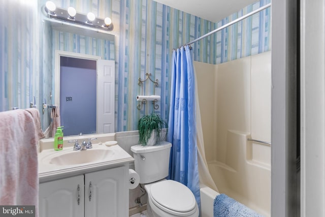 full bathroom featuring vanity, shower / bath combination with curtain, and toilet