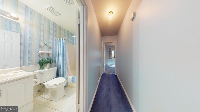 full bathroom with toilet, shower / bath combination with curtain, vanity, and tile patterned floors