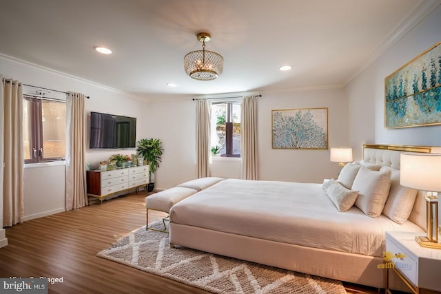 bedroom with ornamental molding, wood finished floors, a chandelier, and recessed lighting