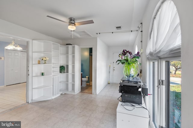 kitchen with ceiling fan with notable chandelier