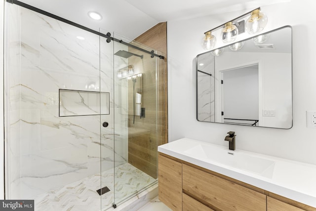 bathroom featuring walk in shower, vanity, and lofted ceiling