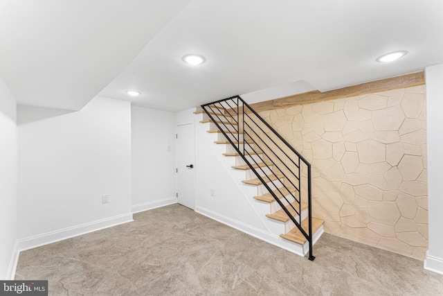 basement featuring light colored carpet