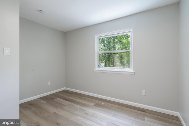 spare room with light hardwood / wood-style floors