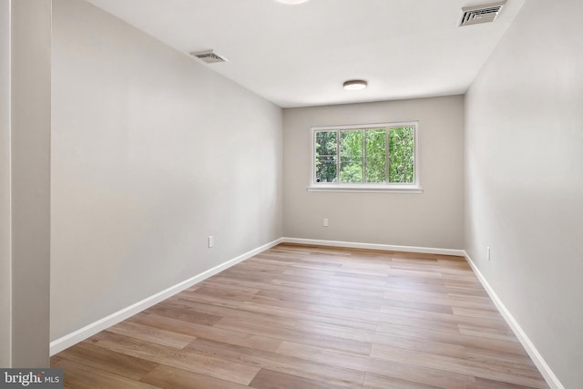 empty room with light hardwood / wood-style floors