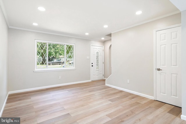 interior space featuring light hardwood / wood-style floors and crown molding