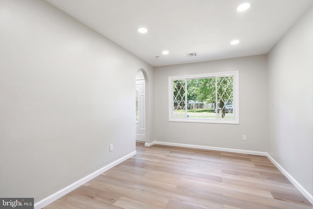 spare room with light hardwood / wood-style flooring