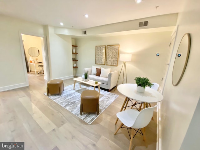 living room with light hardwood / wood-style flooring