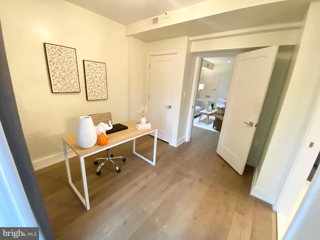 office area with hardwood / wood-style floors