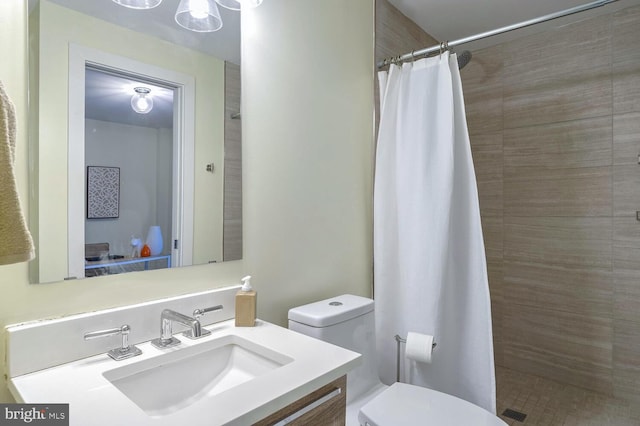 bathroom with walk in shower, vanity, a notable chandelier, and toilet