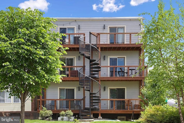 back of property with a balcony