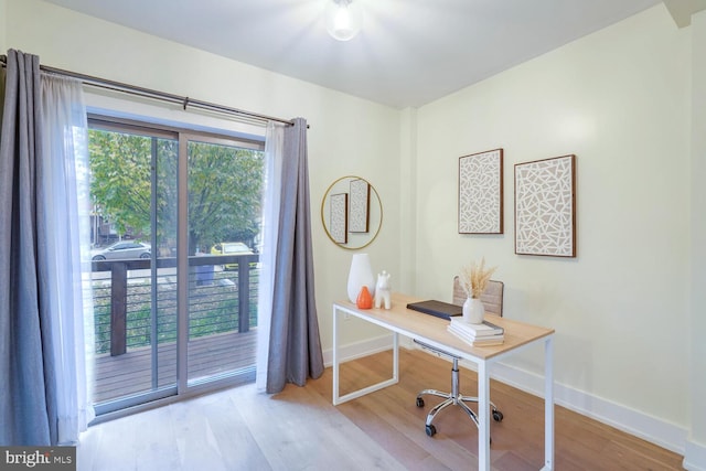 office space with light wood-type flooring