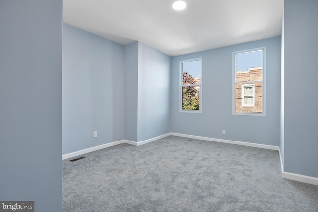 unfurnished room with carpet floors