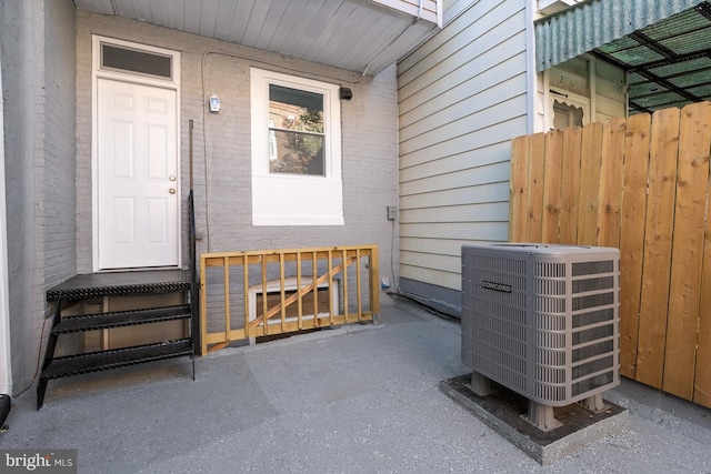 doorway to property featuring cooling unit