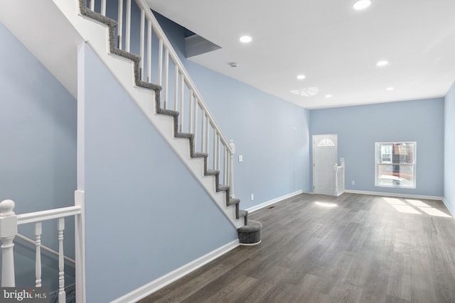 entrance foyer with dark hardwood / wood-style floors