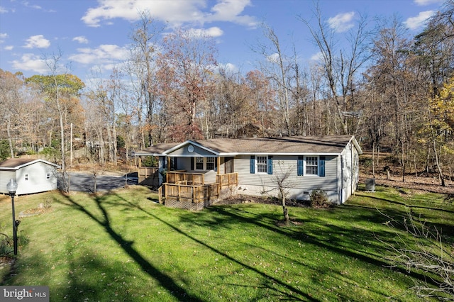 view of front facade featuring crawl space, a front lawn, and a deck