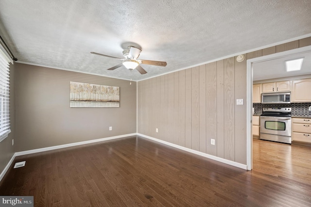 174 Robin Ln, Harpers Ferry, WV 25425 - empty room with wood finished floors, baseboards, ceiling fan, ornamental molding, and a textured ceiling