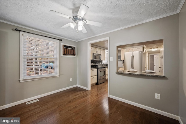 empty room featuring a textured ceiling, dark hardwood / wood-style floors, ceiling fan, and ornamental molding