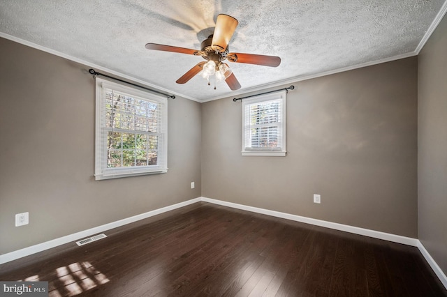 spare room featuring a textured ceiling, dark hardwood / wood-style floors, ceiling fan, and ornamental molding