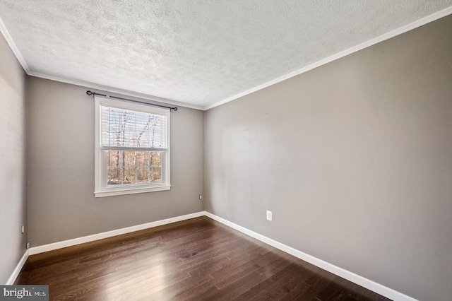 unfurnished room featuring dark hardwood / wood-style floors, ornamental molding, and a textured ceiling