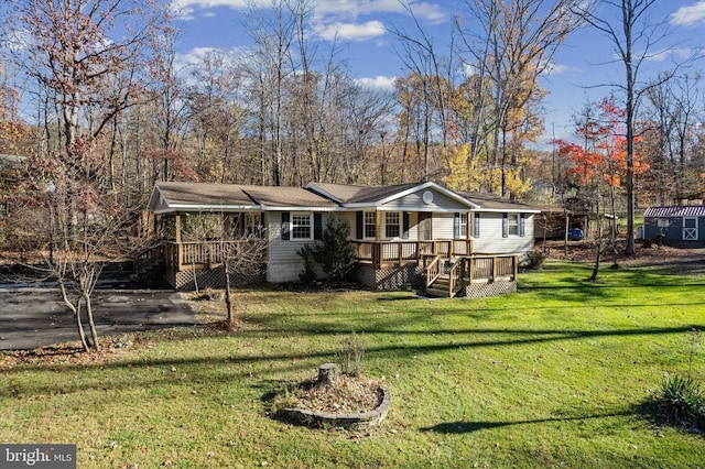 back of house with a yard and a wooden deck