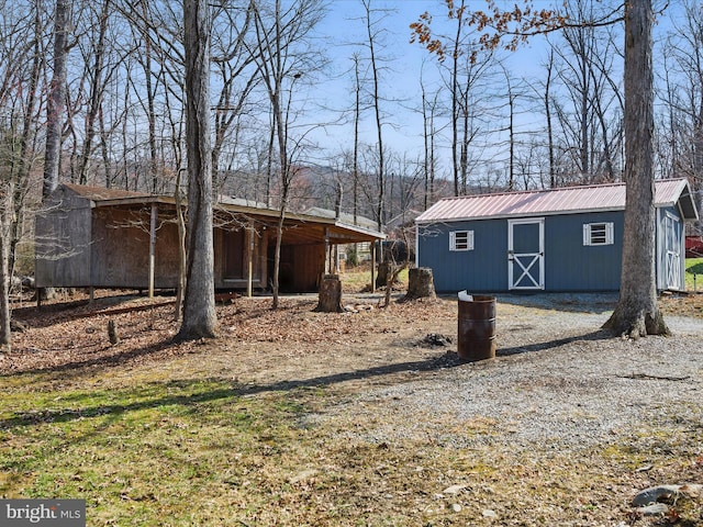 174 Robin Ln, Harpers Ferry, WV 25425 - view of side of property with an outdoor structure and metal roof