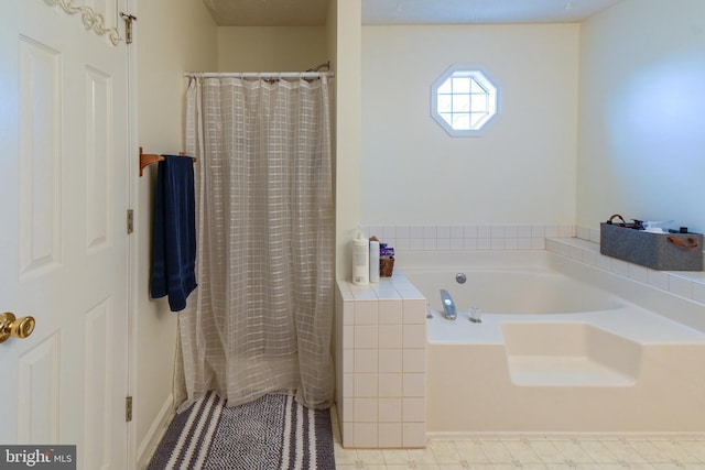 bathroom featuring independent shower and bath