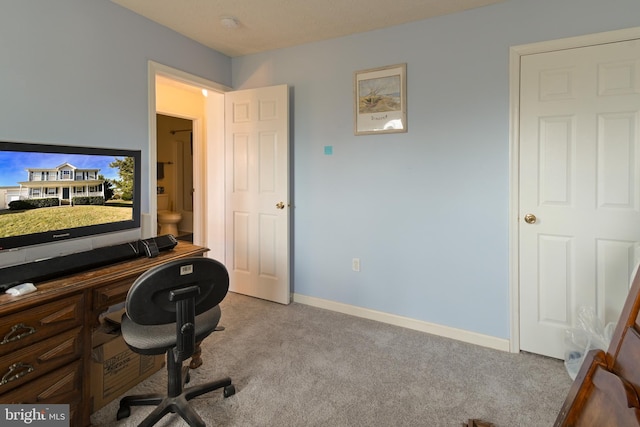 office area featuring light colored carpet