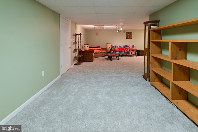 playroom with light colored carpet, track lighting, and a drop ceiling