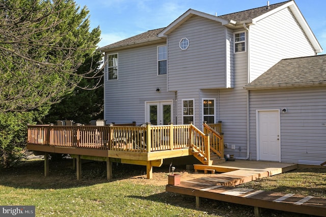 back of property with a wooden deck