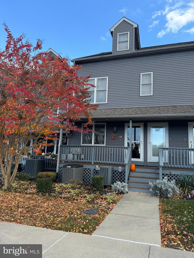 view of front of home featuring covered porch and central AC