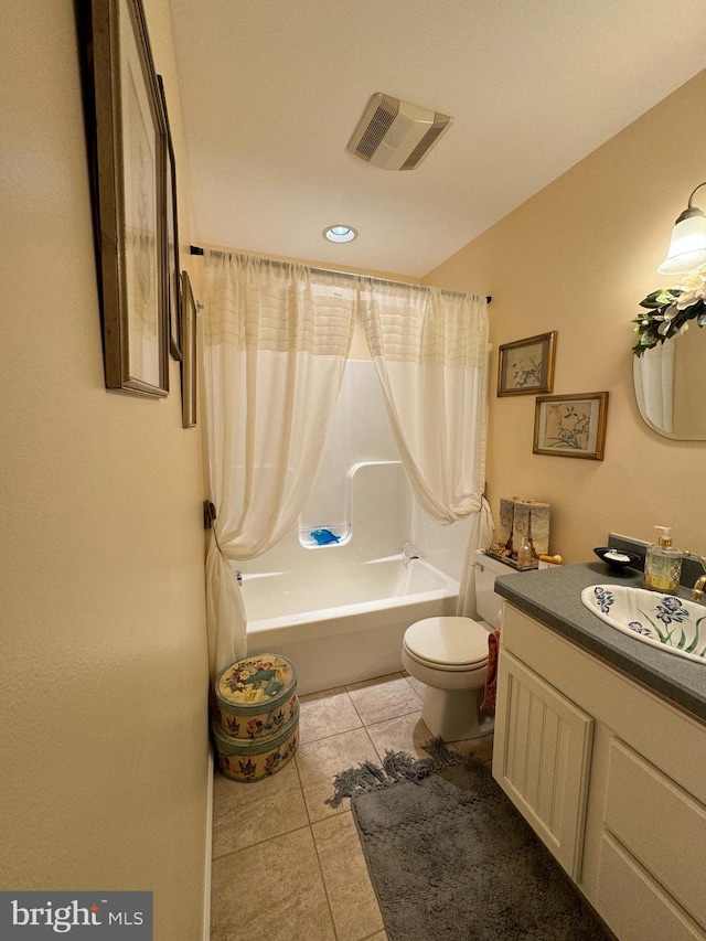 full bathroom featuring toilet, vanity, tile patterned floors, and shower / bathtub combination with curtain