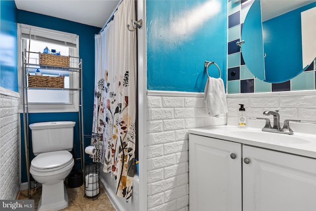 bathroom with tile patterned floors, decorative backsplash, vanity, and toilet