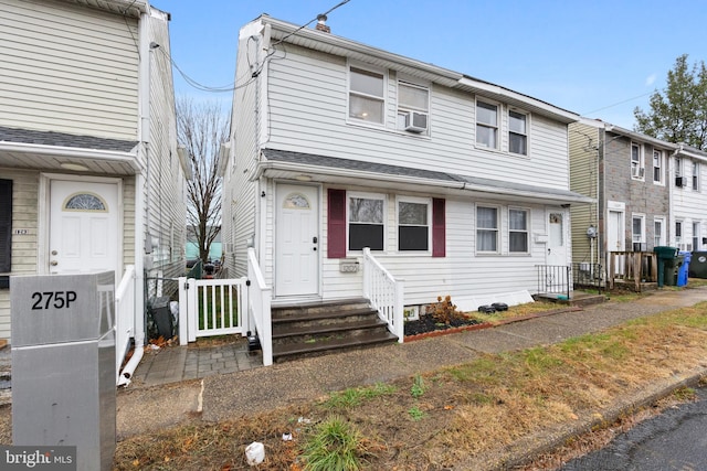 view of front of home featuring cooling unit